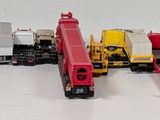 a lot of toy trains that are lined up next to each other