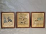 three framed pictures of people sitting on a couch in a living room