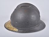 a helmet that is sitting on a white surface