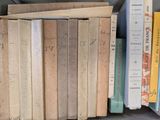 a lot of books that are on a shelf
