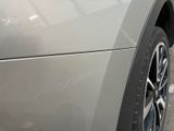 a close up of a car ' s front wheel and tire
