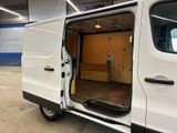 a white van with the door open in a building