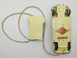 a yellow telephone with a cord attached to it