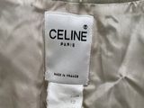 a close up of a label on a dress with a chain on it