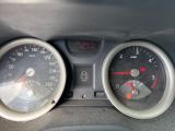 two gauges on the dashboard of a car