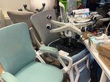 a desk with a chair and a computer on it