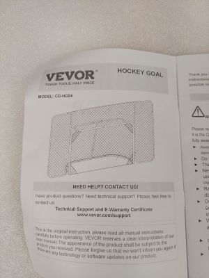 someone is reading a manual on how to use a hockey goal