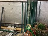 a room that has a bunch of tools and a wheelbarrow