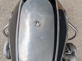 a close up of a motorcycle parked in a parking lot