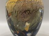 a glass vase that is sitting on a table