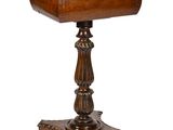 an old wooden table with a wooden top and a wooden base