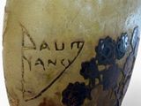 a vase that has writing on it on the side of it