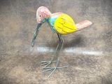 a small bird that is standing on a table