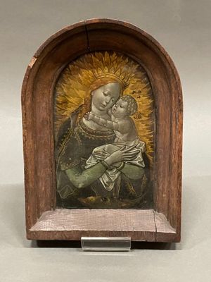 painting of a woman holding a child in a wooden frame