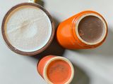 two cups of coffee sitting next to each other on a table