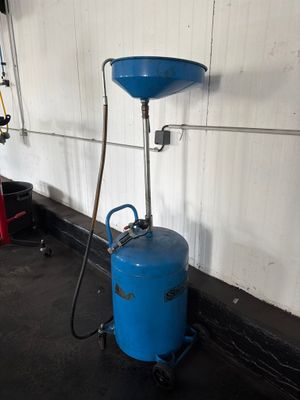 an image of a blue tank with a hose attached to it