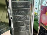 an image of a glass door refrigerator in a store