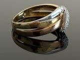 an image of a close up of a ring on a reflective surface