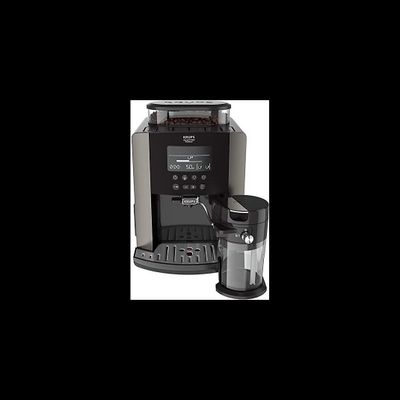 the coffee maker is next to a cup of coffee on the table