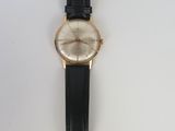 an image of a wrist watch on a white surface
