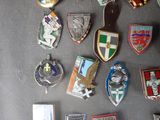 a lot of badges that are on a table