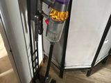 a vacuum that is sitting on the floor next to a door