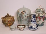 many vases and bowls sitting on a white surface