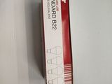 a box of toothpaste sitting on a white surface