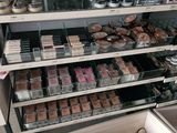 a lot of makeup products on the shelves in the store