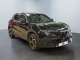 a picture of a black car in a showroom