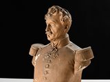 a bust of a man in a military uniform on a table
