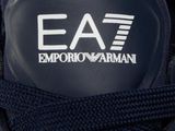 the logo on the shoe of a man who is wearing an ea7 emporio armani