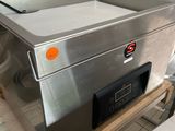 a machine that is sitting on a table in a kitchen