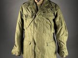 an olive green jacket on a mannequin mannequin mannequin mannequin mannequin mannequin mannequin mannequin manne