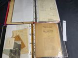 a lot of books that are open on a table