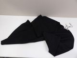 a pair of black pants laying on a white table