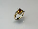a close up of a ring on a table with a white background