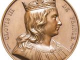 an image of a gold coin with a portrait of a man wearing a crown