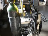 a fire extinguisor sitting on a cart in a garage