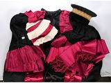 a black and red dress with a hat on top of it