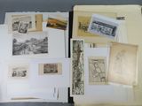 a lot of drawings and pictures on the table