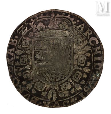 an old silver coin with an ornate design on it