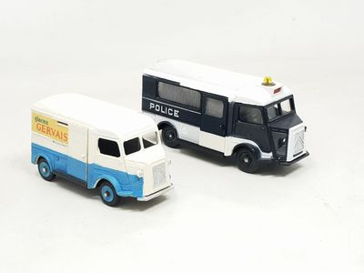 two toy trucks that are sitting next to each other