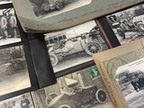 many old photos of old cars on the table