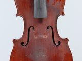 a close up of a violin on a stand against a white background