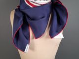 a close up of a mannequin torso with a scarf on it