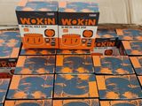 several boxes of orange and blue boxes of wax on a table