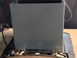 a laptop computer sitting on top of a wooden desk