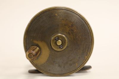 a metal object that is on a white surface