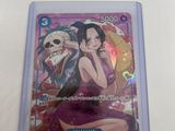 a close up of a card in a plastic case on a table